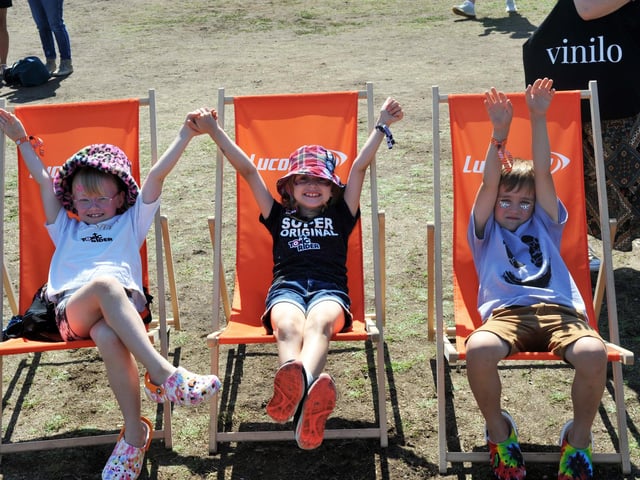 Three young festival-goers taking it easy. Picture by Paul Windsor
