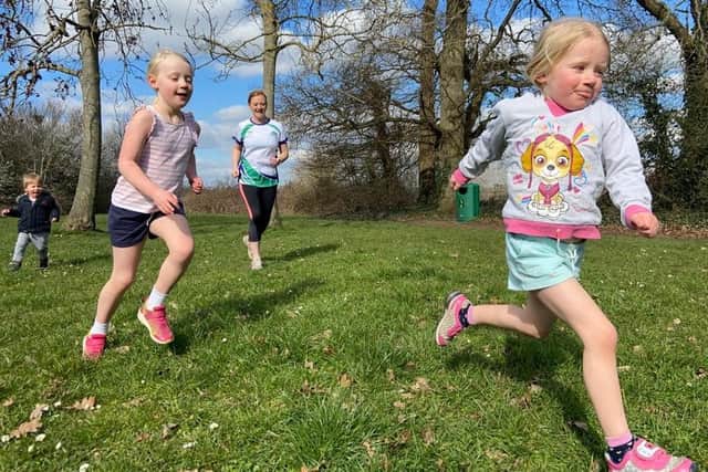 Vicky Monk from Fareham is to take on the London Marathon in memory of her cousin. Pictured: Vicky and her three children supporting her marathon training