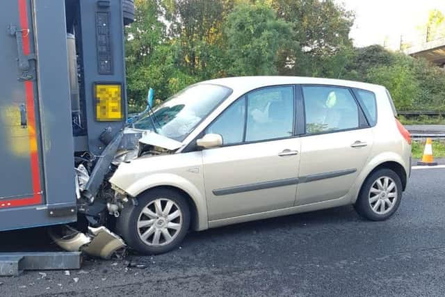 A female driver in a gold Renault Scenic could not avoid the wreckage and was hospitalised after the crash. Picture: Sussex Constabulary.