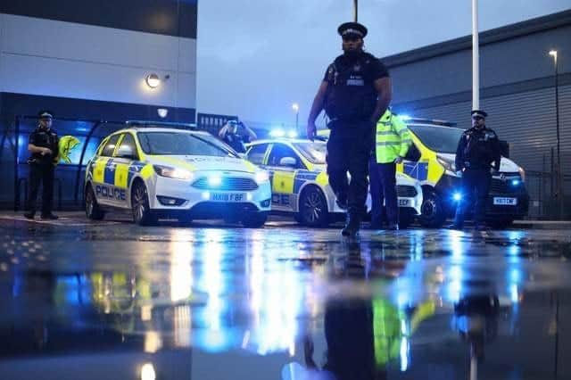Portsmouth police pictured at night in the city
