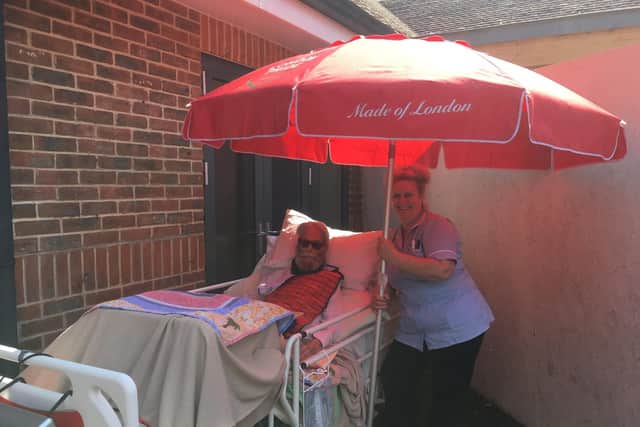 Dolly Gray, 92, with one of the care staff at the Rowans Hospice. The care Dolly has received was one of the inspirations behind the medal.