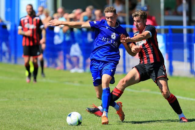 Kelvin Robinson, left, conceded the penalty which allowed Badshot Lea to take a 2-0 FA Vase lead.
Picture: Chris Moorhouse