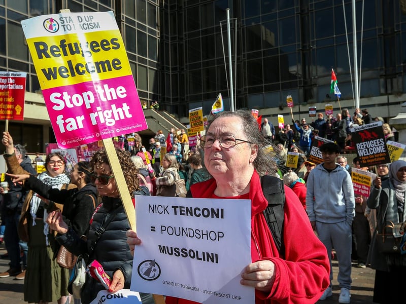 A Unity Rally attendee holds up a stop the far right sign. Picture: Chris Moorhouse (150325-060)
