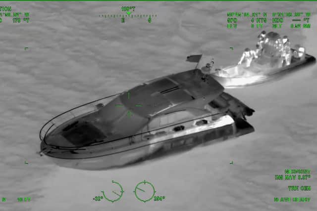 Footage from a shadowing aircraft captures the moment Border Force intercept Charles Lynch, also known as Wolfram Steidl, on a 46ft motor cruiser with eight Albanian migrants in the English Channel before they are brought back to Portsmouth on November 6, 2019. Picture: National Crime Agency