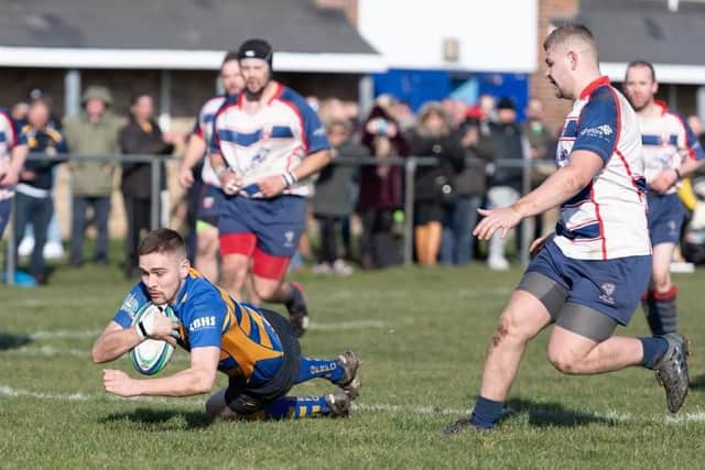Gosport & Fareham's double try scorer Dom Philo goes over in his side's victory over Sandown & Shanklin Picture: Martin Burnett