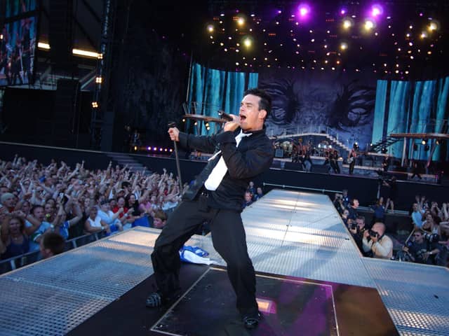 Robbie Williams takes to the stage at BST Hyde Park this weekend (July 6), but will the weather hold out for the “Angels” singer? (Credit: Getty Images)