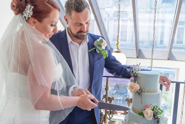 The happy couple cut their cake. Picture: Carla Mortimer Photography