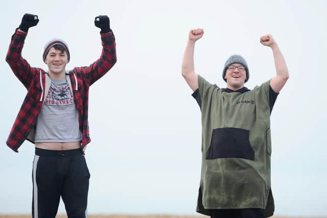 Connor Wornham (left) and Stuart Lovibond, both from Gosport, after their two minute dip in the sea.

Picture: Sarah Standing (010121-326)