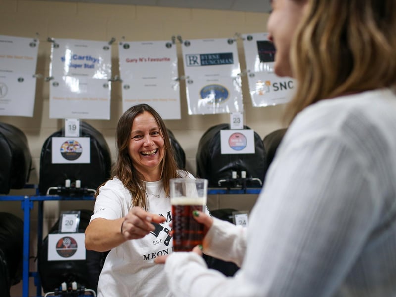 Liz Bugge, left, serves some beer. Wickham Beer Festival, Wickham Community CentrePicture: Chris  Moorhouse (051024-057)