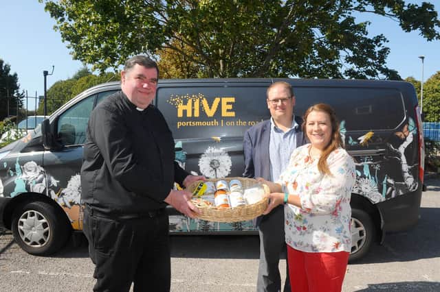 Father Bob White with Fratton residents Brian and Maggie Moles at the launch of the Harvest Appeal, called With Thankful Hearts. Picture: Sarah Standing (140920-3983)