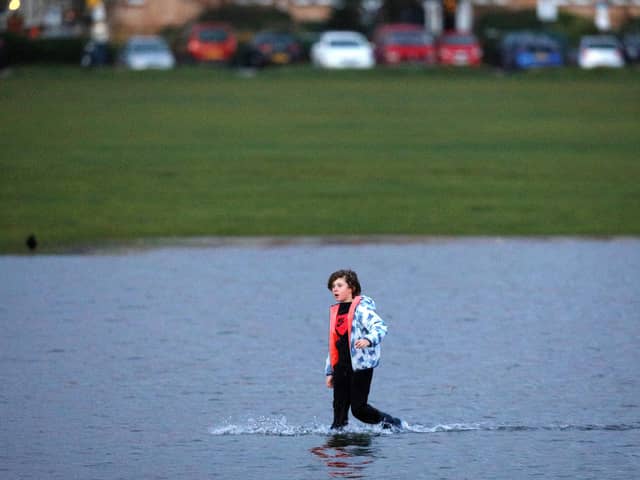 A boy paddles on Southsea Common, after Storm Barra. Picture: Chris Moorhouse   (jpns 071221-17)