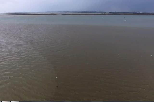 A large sewage water plume is pictured spreading out across Langstone Harbour. Photo: Mathew Orchard