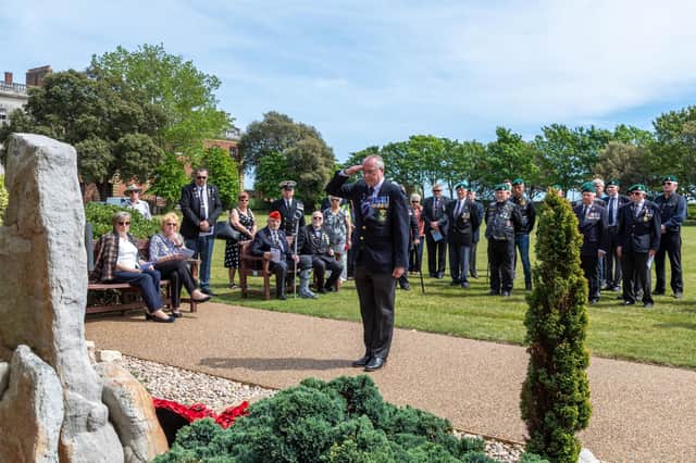 A salute for the fallen from a Royal Marine veteran at the memorial service in Eastney on Saturday, May 21. Picture: Mike Cooter (210522)