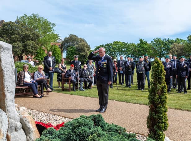 A salute for the fallen from a Royal Marine veteran at the memorial service in Eastney on Saturday, May 21. Picture: Mike Cooter (210522)