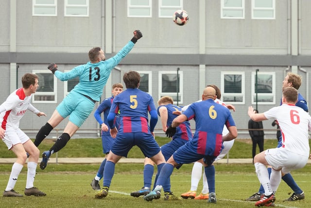 US Portsmouth goalkeeper Owen Craig punches clear. Picture: Keith Woodland