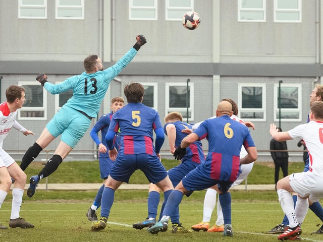 US Portsmouth goalkeeper Owen Craig punches clear. Picture: Keith Woodland