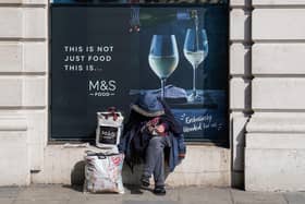 A homeless man sits outside a Marks and Spencer in Mayfair, London as the government has asked local authorities in England to house all rough sleepers and those in hostels and night shelters by the weekend, the charity Crisis said. Picture: Aaron Chown/PA Wire