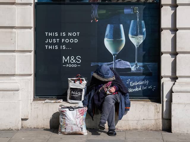 A homeless man sits outside a Marks and Spencer in Mayfair, London as the government has asked local authorities in England to house all rough sleepers and those in hostels and night shelters by the weekend, the charity Crisis said. Picture: Aaron Chown/PA Wire