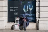 A homeless man sits outside a Marks and Spencer in Mayfair, London as the government has asked local authorities in England to house all rough sleepers and those in hostels and night shelters by the weekend, the charity Crisis said. Picture: Aaron Chown/PA Wire