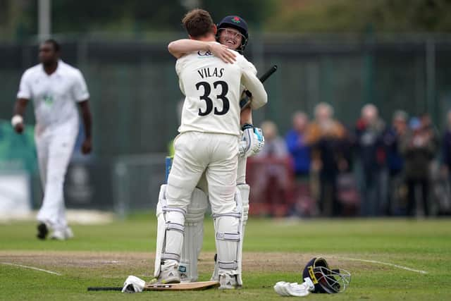 Dane Vilas (left) and Matt Parkinson celebrate victory over Hampshire. Picture: Martin Rickett/PA Wire.