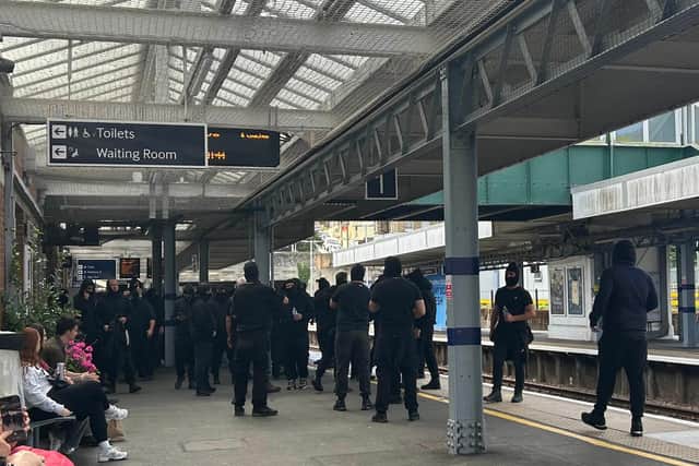 Protesters at Dover Priory train station after black-clad and masked anti-illegal migrant demonstrators blocked roads in Dover during a protest. Picture date: Saturday September 5, 2026.