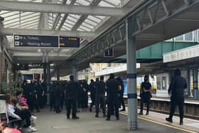 Protesters at Dover Priory train station after black-clad and masked anti-illegal migrant demonstrators blocked roads in Dover during a protest. Picture date: Saturday September 5, 2026.