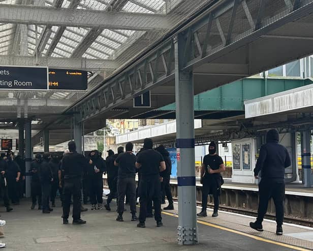 Protesters at Dover Priory train station after black-clad and masked anti-illegal migrant demonstrators blocked roads in Dover during a protest. Picture date: Saturday September 5, 2026.