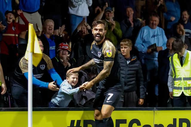 Marlon Pack celebrates with the Pompey fans at Burton earlier this season