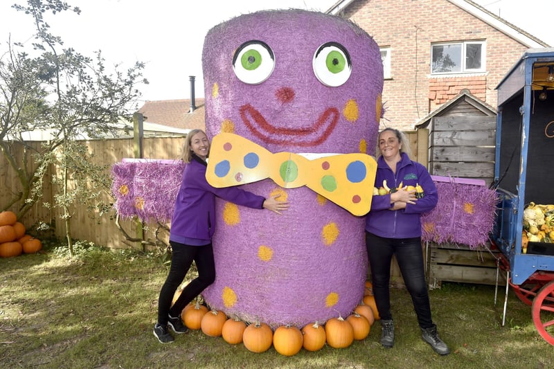 Pictured is: (l-r) Rosie Smith, sales assistant, and Nicky Pycroft, supervisor at Stoke Fruit Farm shop with their giant Mr Blobby
Picture: Sarah Standing (101023-9269)
