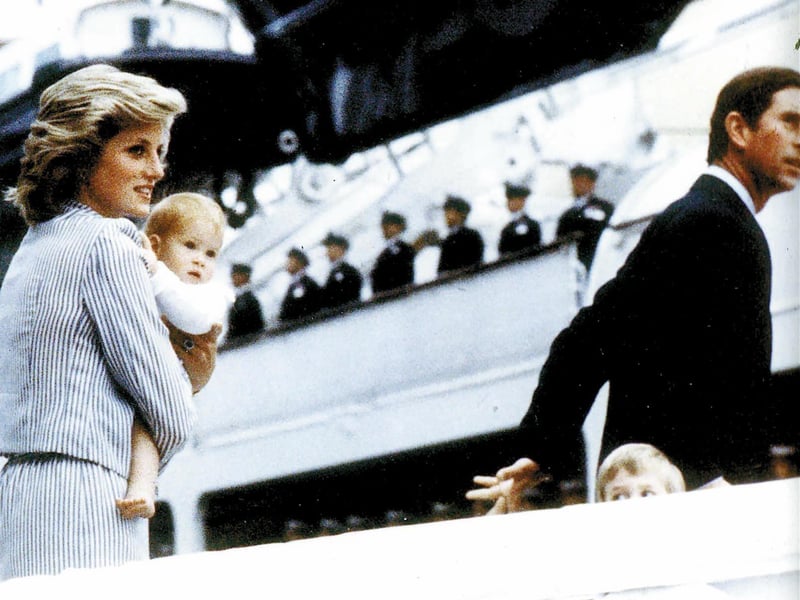Princess Diana carries Prince Harry onto HMS Britannia for a cruise to Scotland with Prince William HRH Prince Charles.