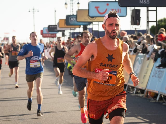 Pictured is: Runners cross the line to finishPicture: Keith Woodland (151021-579)