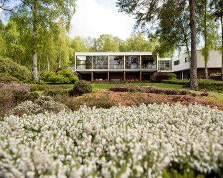 A view from the garden of the exterior of The Homewood, Surrey. The Homewood is a Modernist house built in 1938 by architect Patrick Gwynne.