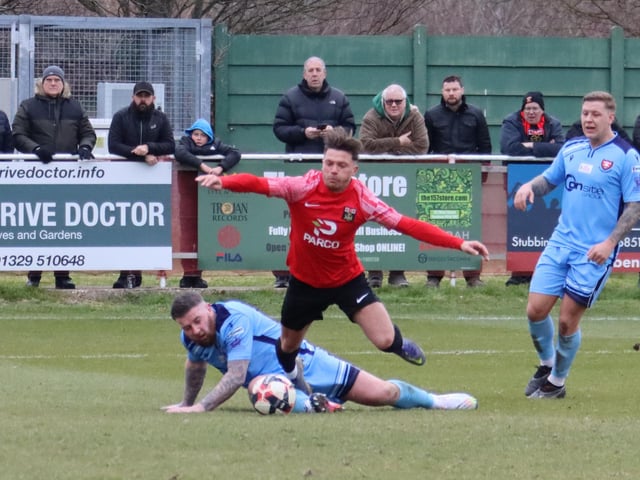 Josh Benfield is brought down by Ryan Woodford to give Fareham a penalty. Picture by Ken Walker.