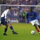 Courtney Pitt, seen here taking on Spurs' Chris Perry in a July 2001 pre-season friendly, made 41 appearances for Pompey. Picture: Steve Reid