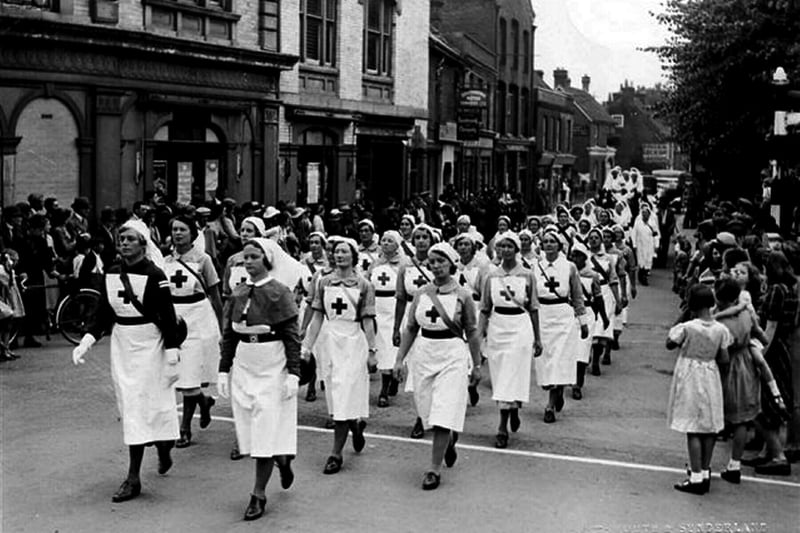 Sent in by  Richard Boryer of Havant we see members of the Havant Red Cross marching up South Street in Havant. The date is July 1941 and leading the marching party in the dark dress is a Miss Paxman. To her right as we look with the collar is Mrs Weeks and over Miss Paxman's shoulder is Miss Binford-Norman.