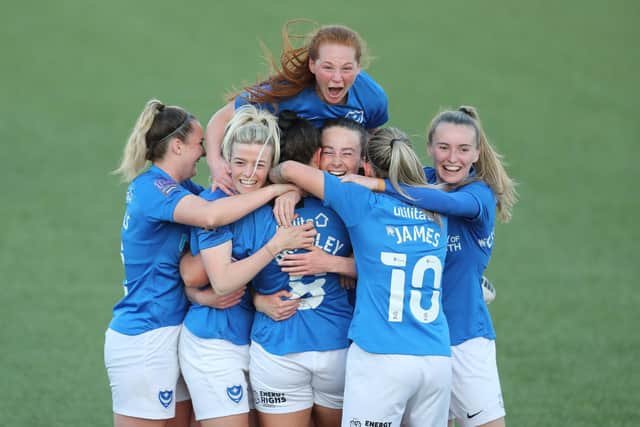 Jade Bradley is mobbed after putting Pompey ahead from a free-kick. Picture by Dave Haines.