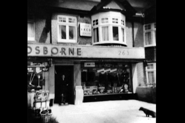 Trusty the dachshund and Cyril Osborne outside their shop in White Hart Lane, Portchester, in 1959