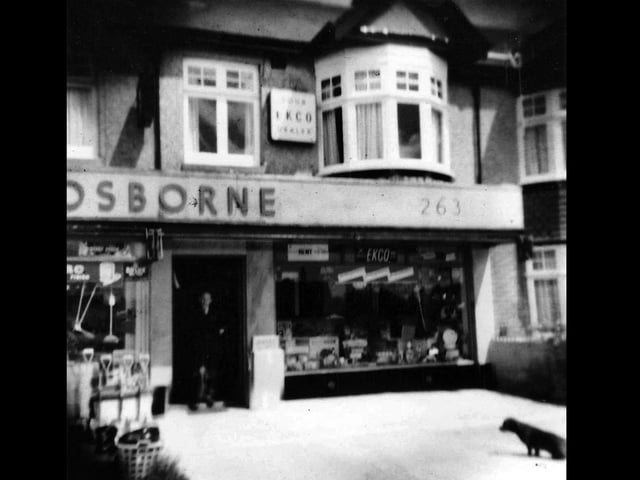 Trusty the dachshund and Cyril Osborne outside their shop in White Hart Lane, Portchester, in 1959