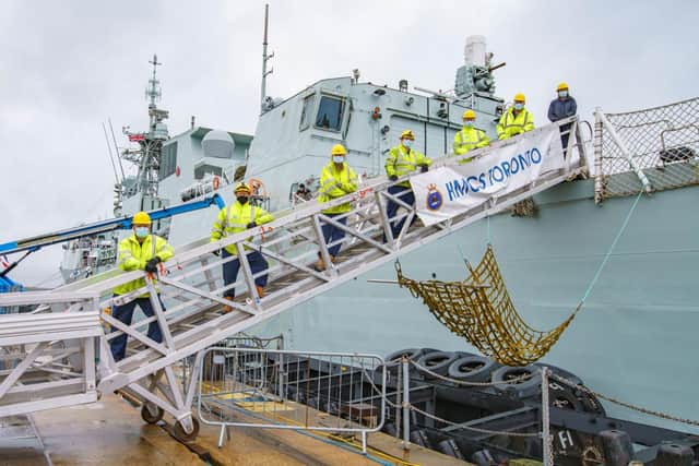 Engineers from BAE Systems pictured on HMCS Toronto, a Canadian warship they helped repair in Portsmouth. Photo: BAE Systems.