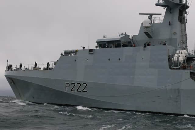 HMS Forth sails past the wrecks of HMS Ardent and Antelope