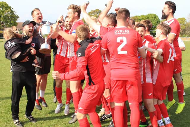 Colden Common celebrate winning the Hampshire Premier League title on the last day with a draw at Hayling United. Picture by Peter Jones