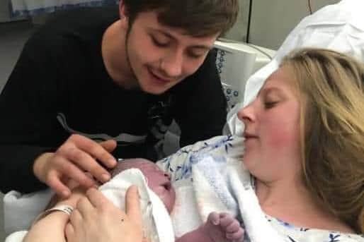 George Allison, pictured at the birth of his daughter, Ruby, with her mum, Courtney Murdoch.