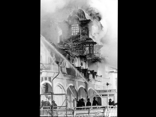 Southsea firefighters put out the flaming pier on June 11, 1974. The News PP4153