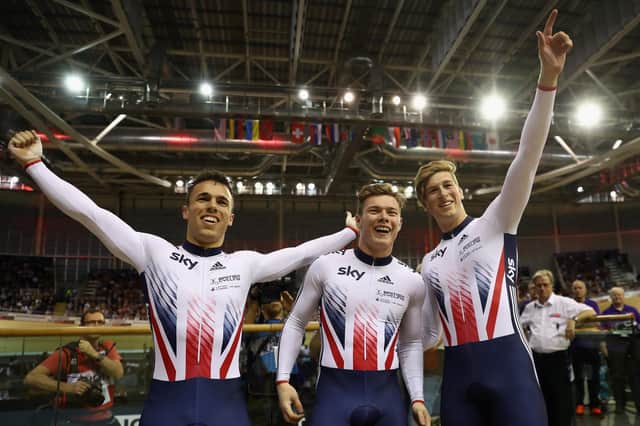 Joe Truman, right, Ryan Owens and Jack Carlin celebrate winning the Men's Team Sprint during day three of the UCI Track Cycling World Cup at the Sir Chris Hoy Velodrome in November, 2016 in Glasgow. Photo by Bryn Lennon/Getty Images.