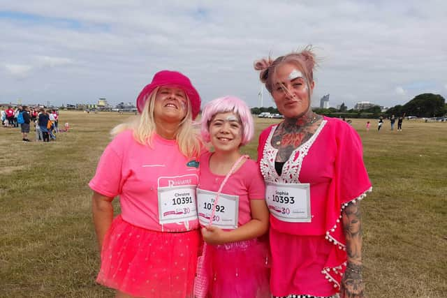 From left, Christine Whittingham, 61, Tilly Phillips, 12 and Sophia Whittingham, 34, at the Race for Life in Southsea. Picture: David George