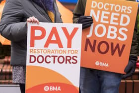 Placards at the resident doctors picket line outside Leeds General Infirmary during a walkout last year. PIC: Danny Lawson/PA Wire