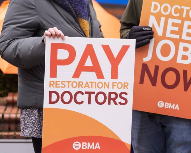 Placards at the resident doctors picket line outside Leeds General Infirmary during a walkout last year. PIC: Danny Lawson/PA Wire
