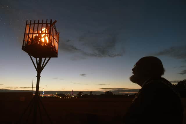 : The Lord Mayor of Portsmouth Hugh Mason looks on at the lit beacon at Southsea Castle.
Picture: Sarah Standing (020622-8867)