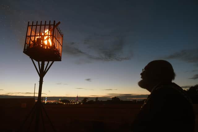: The Lord Mayor of Portsmouth Hugh Mason looks on at the lit beacon at Southsea Castle.

Picture: Sarah Standing (020622-8867)