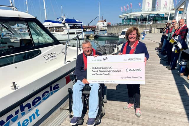 Wetwheels founder Geoff Holt MBE receives cheque from Amanda James from the Green Diamond Club